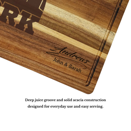 Acacia wood cutting board with deep juice groove and thick construction showing quality craftsmanship and durability