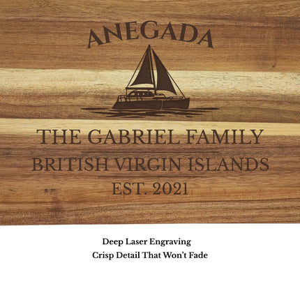 Close up of Anegada British Virgin Islands sailboat cutting board engraving showing detailed sailboat design and clean acacia wood grain