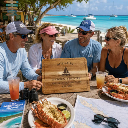 Anegada British Virgin Islands personalized cutting board being shared during a Caribbean lobster lunch gathering beside shallow turquoise waters and remote white sand beaches