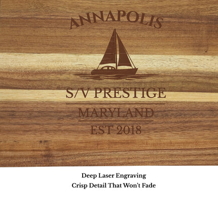 close up laser engraving detail on Annapolis sailboat cutting board showing sailboat design and wood grain
