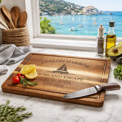 Avalon Harbor California sailboat cutting board displayed in coastal kitchen with ocean view and fresh ingredients