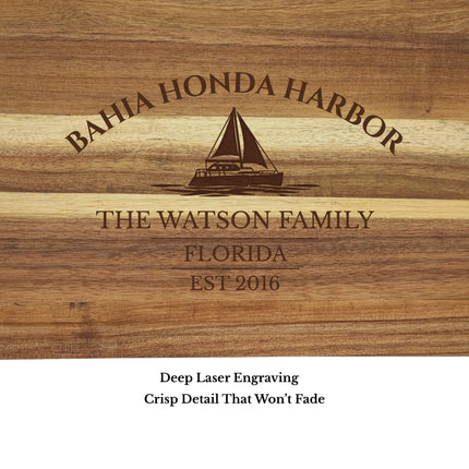 Close up of Bahia Honda Harbor Florida sailboat cutting board engraving showing detailed sailboat design and acacia wood grain