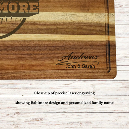 Close up of laser engraved Baltimore skyline baseball design on personalized acacia wood cutting board