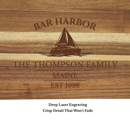 Close up engraving detail of Bar Harbor Maine sailboat cutting board showing sailboat design and custom boat name