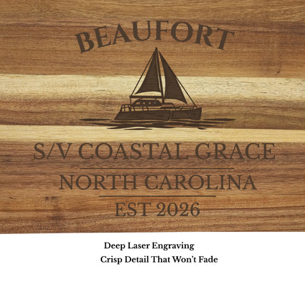 Close up of Beaufort North Carolina sailboat engraving on acacia wood cutting board showing detailed laser engraving quality