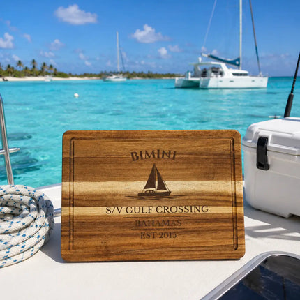 Bimini Bahamas sailboat cutting board on a catamaran deck overlooking turquoise Caribbean water and tropical island anchorage