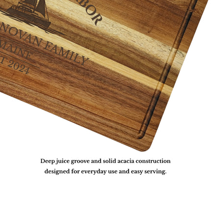 Close up of acacia wood grain and juice groove on personalized Boothbay Harbor Maine sailboat cutting board