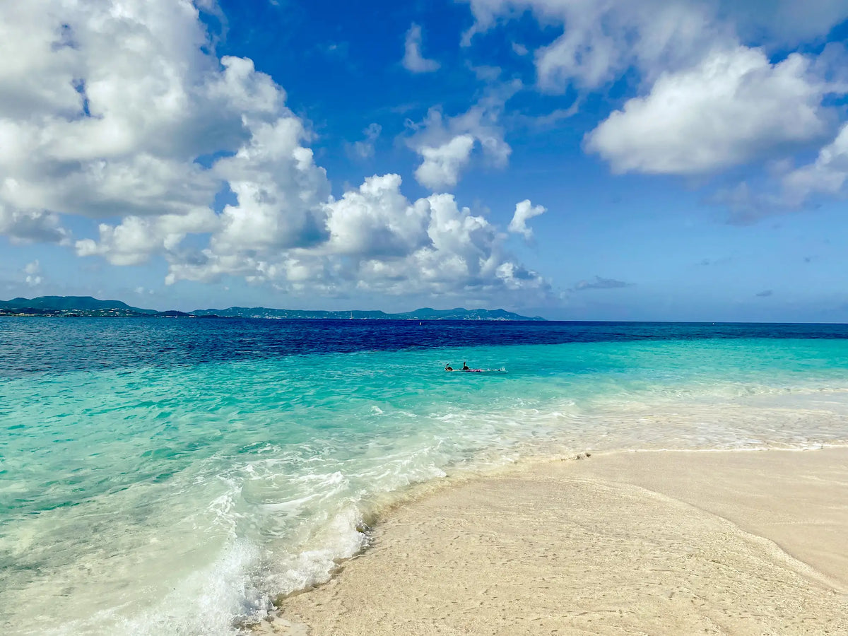 White sand beach and crystal-clear turquoise water at Turtle Beach on Buck Island Reef National Monument near St. Croix, U.S. Virgin Islands.