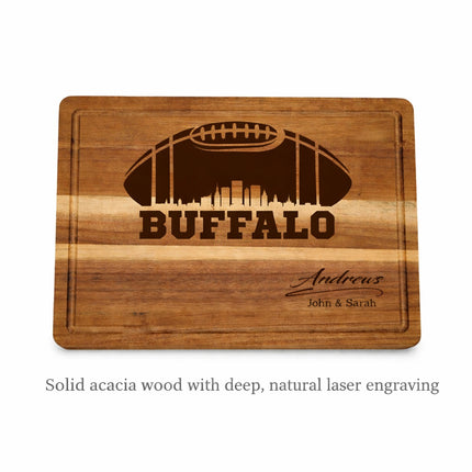 Close-up of a personalized Buffalo football cutting board showing natural dark brown laser engraving on solid acacia wood
