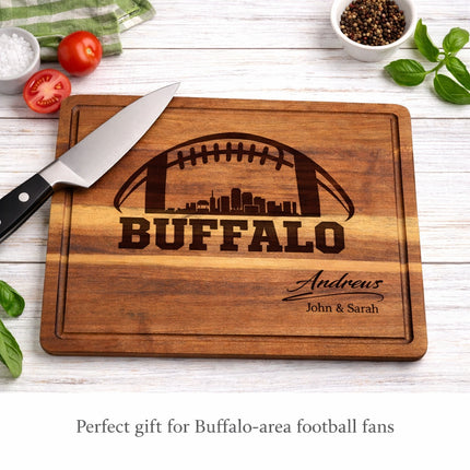 Personalized Buffalo football cutting board in acacia wood shown in a kitchen setting with knife and ingredients, custom laser engraved gift for football fans