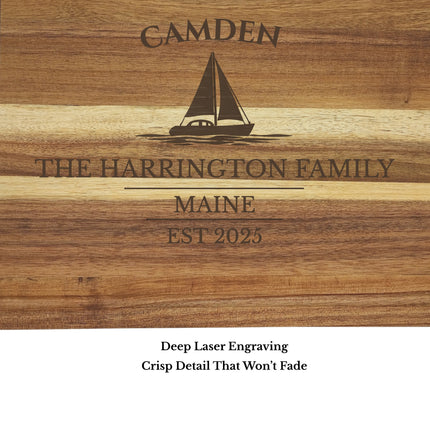 Close up engraving detail of Camden Maine sailboat cutting board showing sailboat design and custom boat name