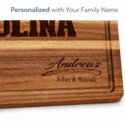 Close-up of personalized Carolina cutting board with custom family name laser engraving