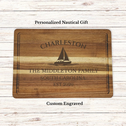 Personalized Charleston South Carolina sailboat cutting board engraved with family name and established year on acacia wood