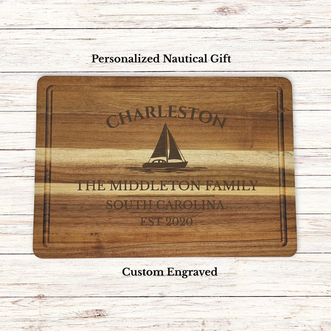 Personalized Charleston South Carolina sailboat cutting board engraved with family name and established year on acacia wood