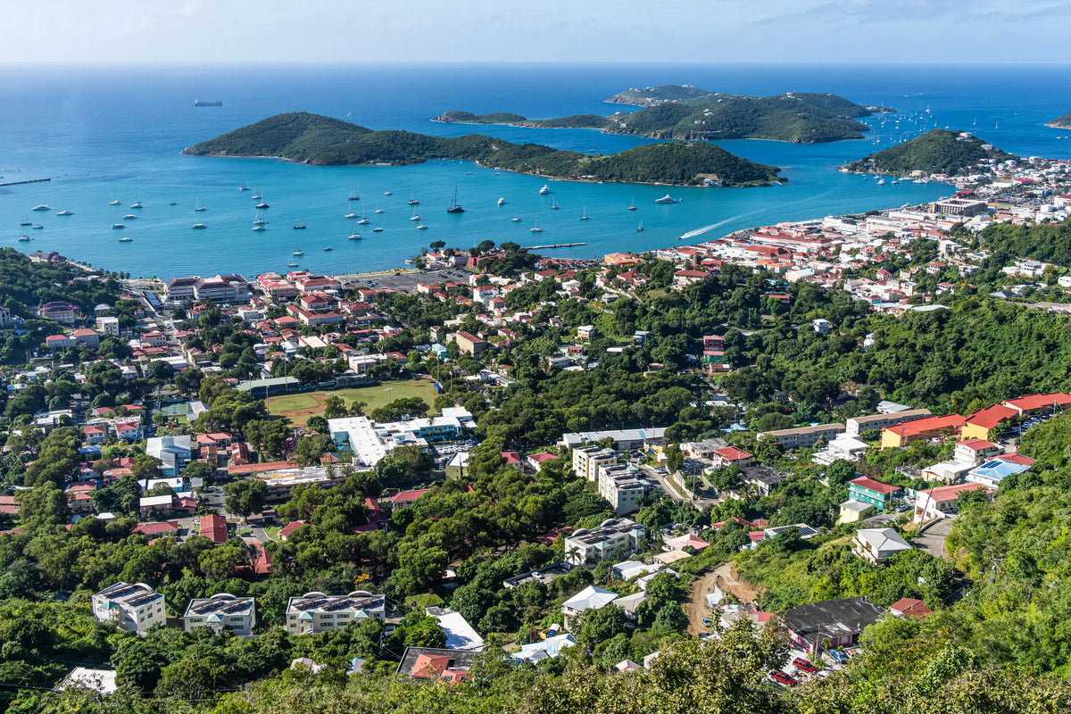 Aerial view of Charlotte Amalie Harbor in St. Thomas, U.S. Virgin Islands, showing the protected harbor, waterfront, and surrounding tropical hills.