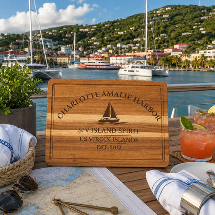 Charlotte Amalie Harbor US Virgin Islands sailboat cutting board displayed overlooking a vibrant Caribbean harbor with yachts colorful waterfront buildings and tropical hillsides