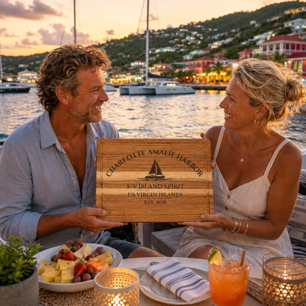 Charlotte Amalie Harbor US Virgin Islands personalized cutting board being shared during a lively Caribbean yacht gathering overlooking colorful harbor lights and sailboats