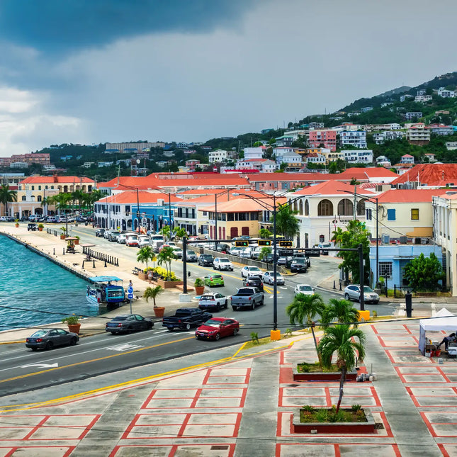 Historic waterfront of Charlotte Amalie in St. Thomas, U.S. Virgin Islands, featuring Danish colonial architecture overlooking the harbor.