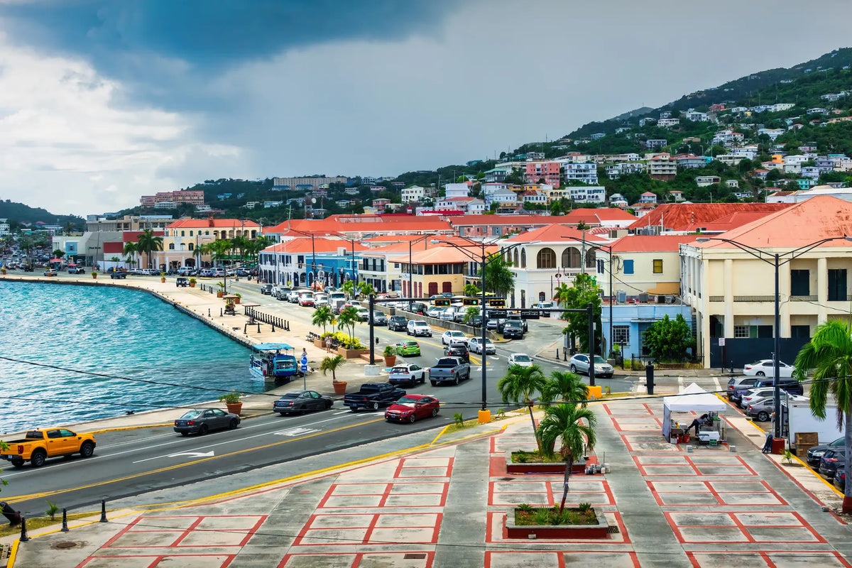 Historic waterfront of Charlotte Amalie in St. Thomas, U.S. Virgin Islands, featuring Danish colonial architecture overlooking the harbor.