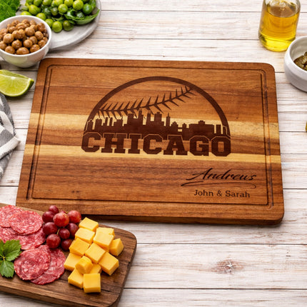 Wooden cutting board with 'Chicago' engraving on a table with food items.