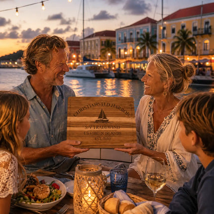 Christiansted Harbor US Virgin Islands personalized cutting board being shared during a warm Caribbean waterfront dinner beside colorful historic harbor buildings and sailboats