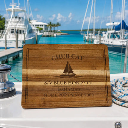Chub Cay Bahamas sailboat cutting board at a tropical marina with offshore boats turquoise water and Bahamas crossing atmosphere