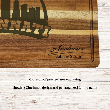 Close up of laser engraved Cincinnati skyline baseball design on personalized acacia wood cutting board