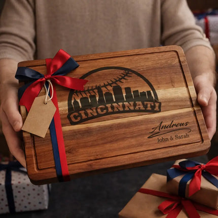 Personalized Cincinnati baseball cutting board presented as a gift with red and navy ribbon and wrapped boxes
