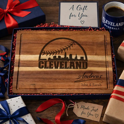 Personalized Cleveland baseball cutting board presented as a gift with wrapped boxes ribbon and team color accents