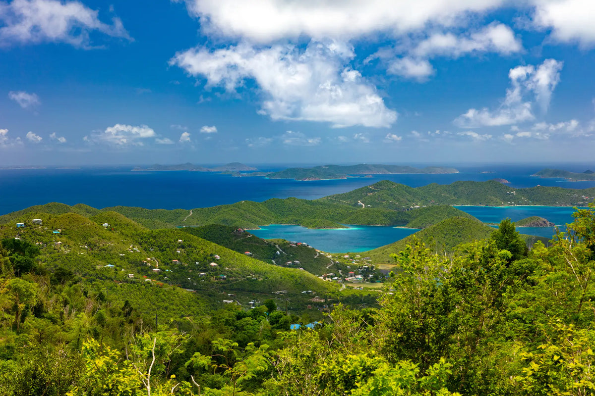 Panoramic overlook of Coral Bay and Hurricane Hole in St. John, U.S. Virgin Islands, with turquoise bays, lush green hills, and the surrounding Virgin Islands.