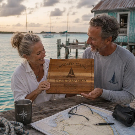 Crooked Island Bahamas personalized cutting board being shared between offshore cruisers at a remote anchorage after a long southern Bahamas passage