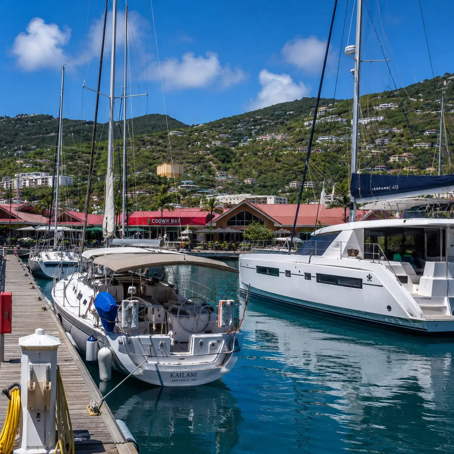 Sailboats and catamarans moored at Crown Bay Marina in St. Thomas, offering full-service facilities for visiting recreational boaters.