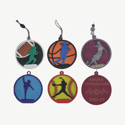 Set of sports-themed keychains on a white background