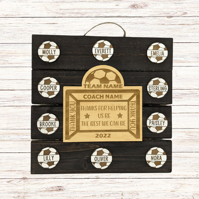 Personalized wooden plaque with names of players and a coach on a wooden background