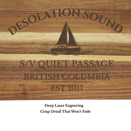 Close up of Desolation Sound British Columbia sailboat cutting board engraving showing detailed sailboat design and clean acacia wood grain