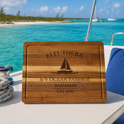 Eleuthera Bahamas sailboat cutting board overlooking open turquoise water with tropical coastline and distant sailboats near pink sand beaches