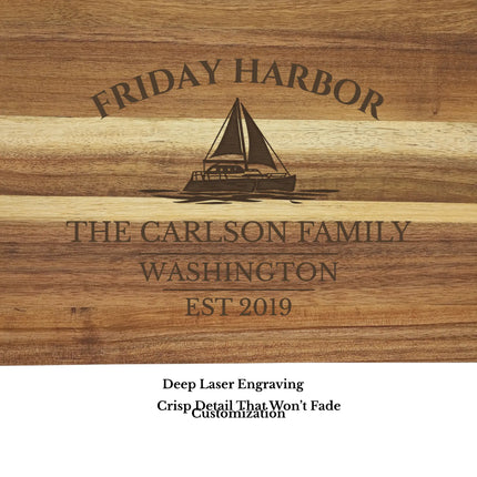 Close up of Friday Harbor Washington sailboat cutting board engraving showing detailed sailboat design and acacia wood grain