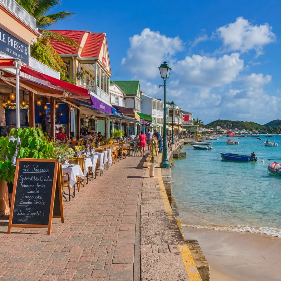 Waterfront restaurants and promenade on Saint Martin showcasing the French-Caribbean dining culture popular with visitors to Grand Case Harbor