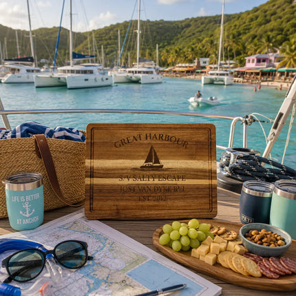 Great Harbour Jost Van Dyke British Virgin Islands sailboat cutting board displayed beside a protected Caribbean anchorage with catamarans dinghies waterfront beach bars and tropical harbor scenery