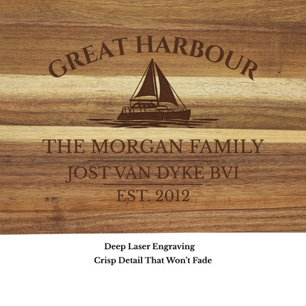 Close up of Great Harbour Jost Van Dyke British Virgin Islands sailboat cutting board engraving showing detailed sailboat design and acacia wood grain