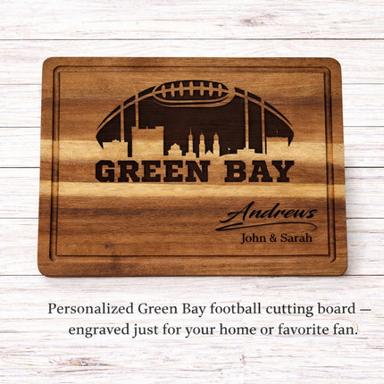 Personalized Green Bay football cutting board engraved with city skyline and custom family name on solid acacia wood
