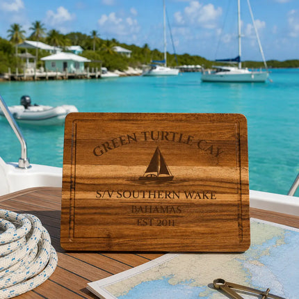 Green Turtle Cay Bahamas sailboat cutting board on a cruising sailboat overlooking calm turquoise anchorage water in the Abacos