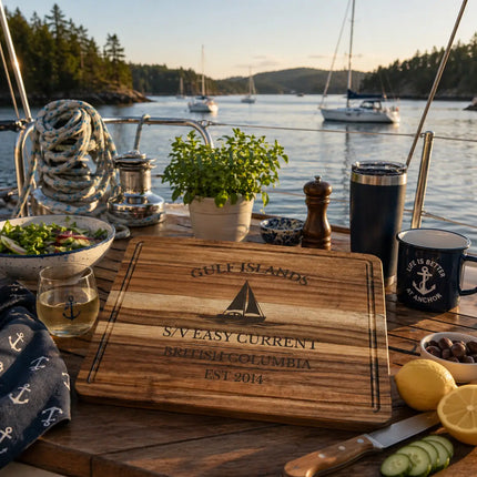 Gulf Islands British Columbia sailboat cutting board on a cockpit table with calm water anchored boats and relaxed food preparation in a quiet cove