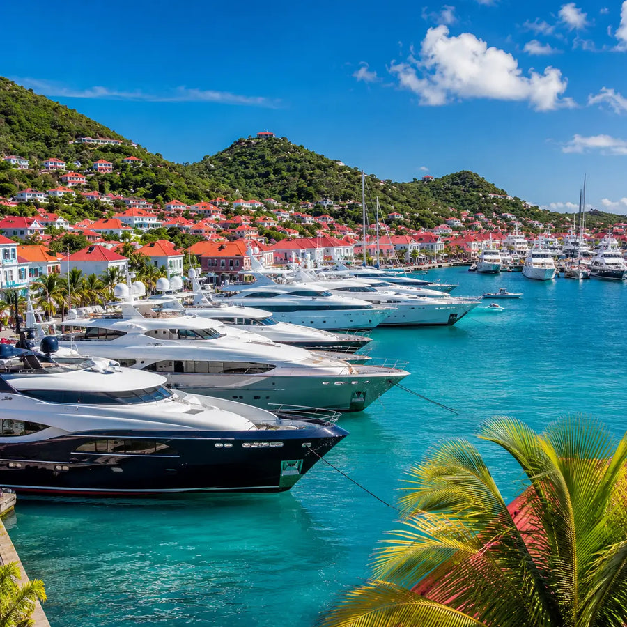 Luxury yachts anchored in Gustavia Harbor, St. Barthélemy, showcasing the island's reputation as one of the Caribbean's premier yachting destinations