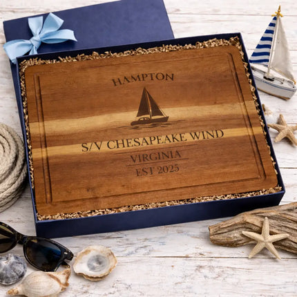 Hampton Virginia sailboat cutting board presented in coastal themed gift box with rope shells driftwood and nautical decor