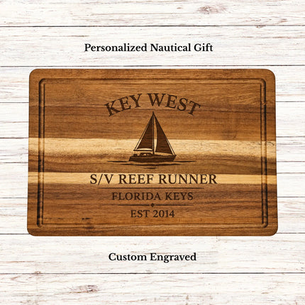 Personalized Harbor Collection acacia wood cutting board featuring a custom home port design with harbor name, sailboat graphic, family or boat name, region, and established year.