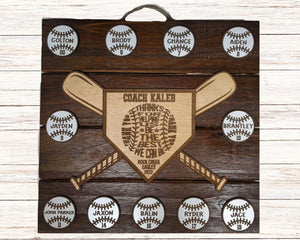 Wooden plaque with engraved text and baseball designs on a wooden background
