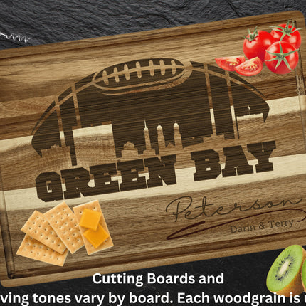 Custom Green Bay football cutting board featuring the city skyline and a football design. Personalized as requested to make a great gift.