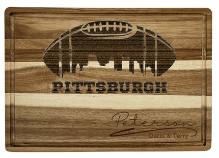 Custom Pittsburgh football cutting board featuring the city skyline and a football design. Personalized as requested to make a great gift.