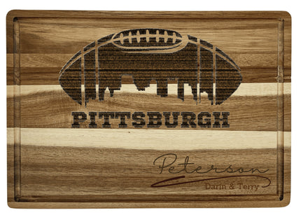 Custom Pittsburgh football cutting board featuring the city skyline and a football design. Personalized as requested to make a great gift.